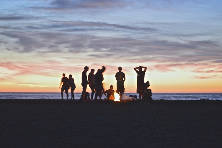 group-enjoying-in-beach